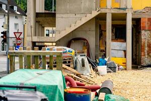 View of various building materials and fixtures near a house under construction photo