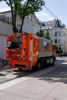 Vienna, Austria - 23.06.2023 Public service employees clean up garbage photo