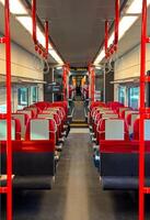 View of the rows of seats in a public transport carriage, train interior photo