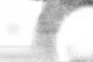 Artistic grayscale gradient with textured and blurred effects, creating a soft abstract background. photo