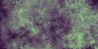 Artistic abstract texture in green and purple tones, featuring a grunge effect with soft, cloudy patterns. photo