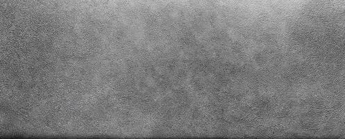A grayscale texture featuring a subtle, fine-grain pattern with a smooth and uniform appearance, ideal for backgrounds. photo