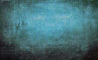 Abstract blue background with textured grunge effect, featuring rough patterns and faded gradient tones. photo