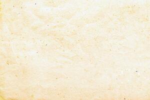 High-resolution close-up of yellowed vintage paper texture with natural fibers and a rustic, aged appearance. photo