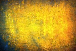 Abstract grunge background with yellow and blue tones, featuring rough textures, distressed patterns, and vintage appeal. photo