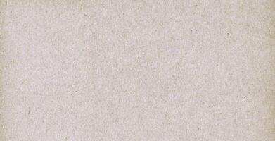 Close-up of a natural recycled paper texture with subtle fiber patterns, ideal for design and crafting projects. photo
