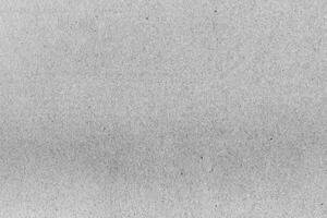 Close-up of a gray recycled paper texture with subtle fibers and organic patterns, perfect for design or backgrounds. photo