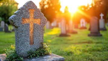 Sunlight casts a warm glow on a gravestone surrounded by greenery in a peaceful cemetery setting photo