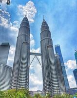Kuala Lumpur, Malaysia on 21 February 2024. Majestic Petronas Towers Twin Skyscrapers Blue Sky Background photo