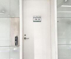 Jeddah, Saudi Arabia on 22 February 2024. White Office Door FD12 Access Card Reader Modern Minimalist Style photo
