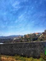 Taif, Saudi Arabia on 24 February 2024. Blue Sky View Buildings Stone Wall Landscape Vivid Colors photo