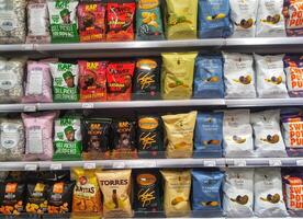 Madinah, Saudi Arabia on 28 February 2024. Rap Snacks Potato Chips Variety Store Shelf Display photo