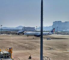 Taipa, Macau on 6 Nov 2024. Airplanes on the tarmac a serene airport view photo