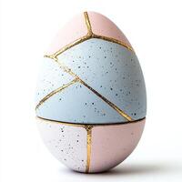 Stylish decorative egg with pastel colors and gold accents. For Easter egg photo