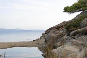 rocks on the sea coast, horizon line photo
