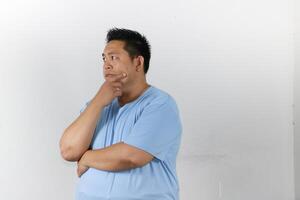 Man in hard Thought over isolated white background photo
