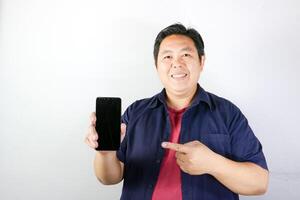 Smiling Man Showing Smartphone Screen photo