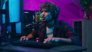 Arabian American Latino man computer e-sport playing victory blog addict smile game winner win streamer match male happy gamer blogger guy cyber home internet rejoice influencer shout yes stream video