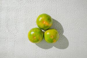three green orange isolated on white texture background photo