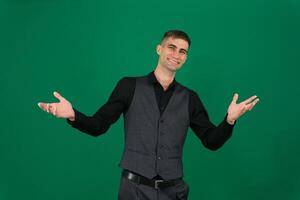 Photo of amazing guy indicating fingers up to empty space advising cool low shopping prices wear casual denim shirt isolated green color background