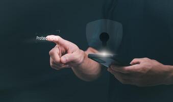 a man holding a smartphone with a keypad and a fingerprint sensor photo