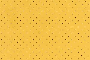 Yellow color abstract artificial leather with dots and holes pattern for background photo