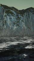 View of a high cliff and black ocean video