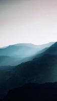 black rocky mountain silhouette in deep fog video