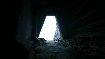 Natural light streaming through an ancient doorway in a stone structure video