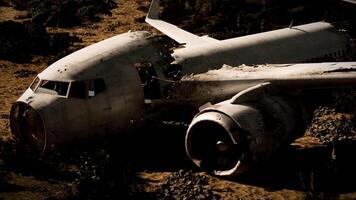 Plane wreckage resting on rugged terrain after a devastating crash event video