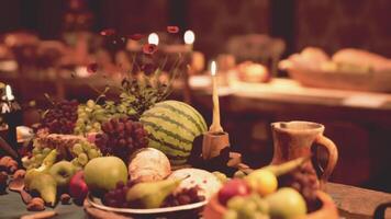 A festive table spread with diverse food and drinks for an evening gathering video