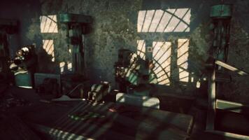 Sunlight casting shadows in an abandoned workshop during late afternoon video