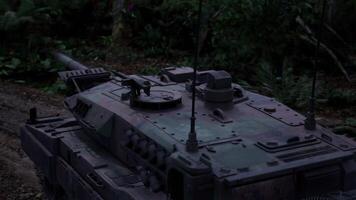 Military tank navigating through dense jungle environment at twilight video