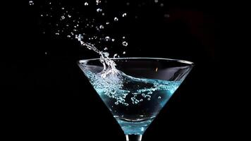 A shot of a glass of water with a splash of water on the side photo