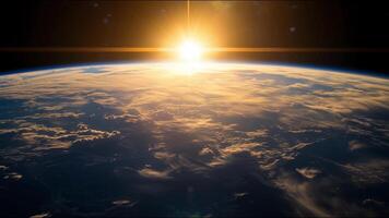 The sun is rising over the planet Earth photo
