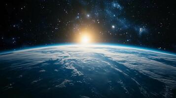 A beautiful view of the Earth from space, with the sun shining brightly on the planet. The sky is filled with stars, creating a serene and peaceful atmosphere photo