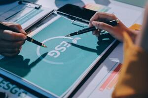 Business people working on a project with a dsg logo photo