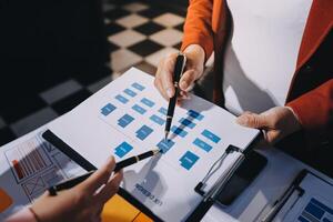 A business person is holding a pen and paper while another person is holding a clipboard photo