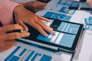 A person is using a tablet with blue and white icons photo
