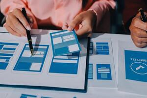 A person is working on a mobile app design photo
