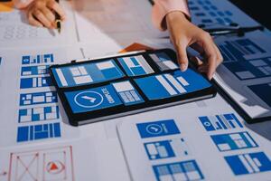 A person is using a tablet to view a design photo