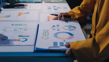 A person is looking at a chart on a table photo