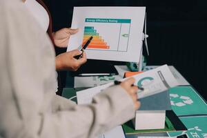 A person holding a paper with a graph on it photo