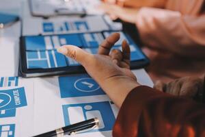 A person is using a tablet to look at social media icons photo