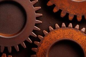 Interlocking rusty gears creating a dynamic industrial mechanism photo