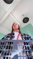 A Young Individual Dressed in a Casual Outfit Enjoys Their Time at a Vibrant Market Setting video