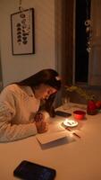 Enjoying a Cozy and Peaceful Writing Session at Night Surrounded by Soft Candlelight video