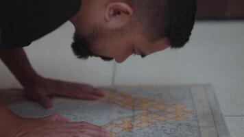 Southeast Asian Indonesian Muslim Man with Black Shirt Salah Salat Zikr Holy Quran Reading Islam Prayer Islamic Ritual in Bed Room, Ramadhan, Eid al-Fitr, eid video