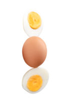Single raw chicken egg and peeled cooked or boiled egg with egg yolk in two halves in stack isolated with clipping path in file format png