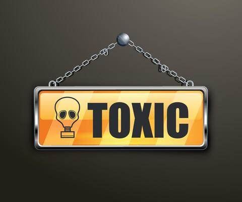 yellow sign with the inscription toxic on a white background